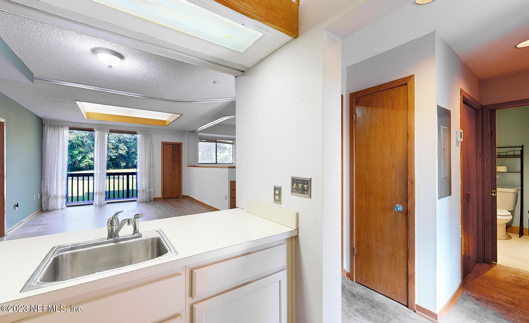 2910 Ravines Road, Unit 1102 Middleburg, FL 32068 - Photo 9 of 43 a view of a kitchen from the hallway