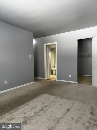 a bathroom with a sink toilet mirror and vanity