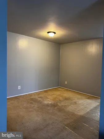 an empty room with staircase