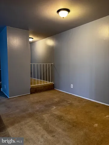 a kitchen with a sink a refrigerator freezer a stove top oven a counter space and cabinets