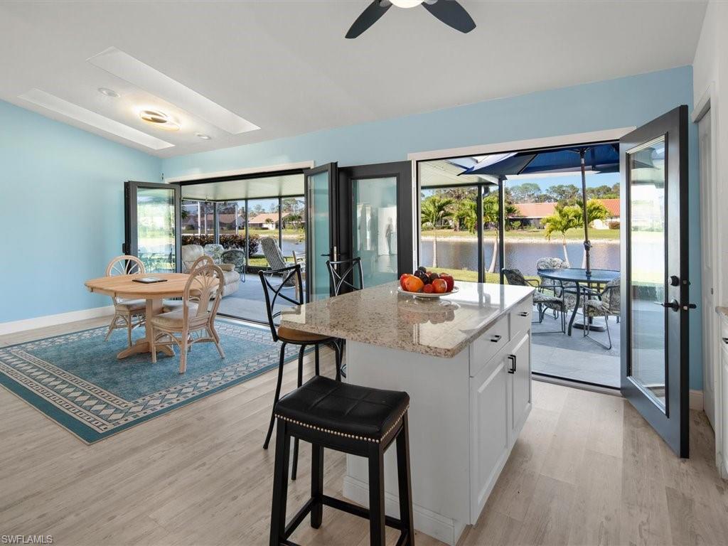 360 Fox Den Circle Naples, FL 34104 - Photo 14 of 41 a view of a kitchen and dining room