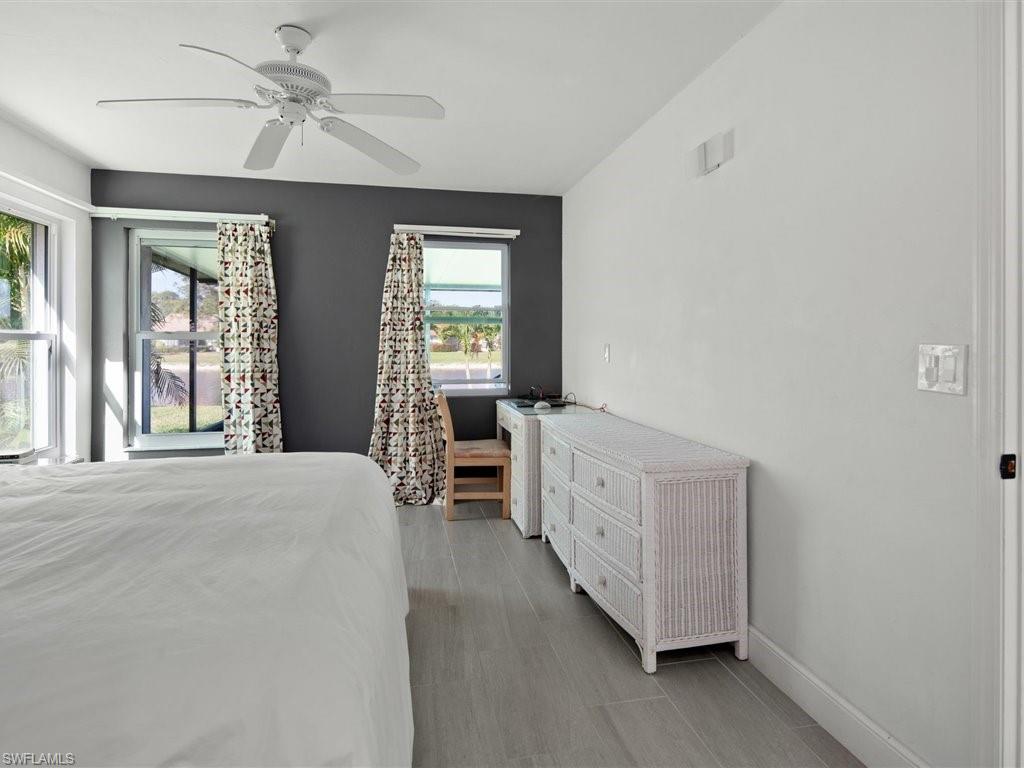 360 Fox Den Circle Naples, FL 34104 - Photo 19 of 41 a bed room with a bed and a window