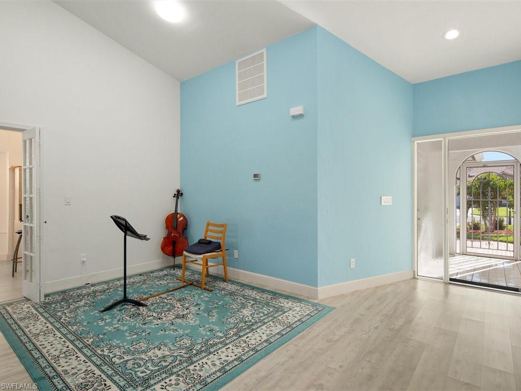 360 Fox Den Circle Naples, FL 34104 - Photo 22 of 41 a living room with furniture rug and rug
