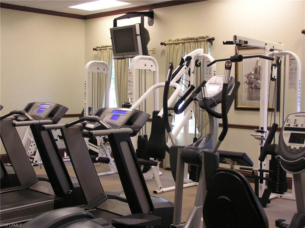360 Fox Den Circle Naples, FL 34104 - Photo 35 of 41 a view of a room with gym equipment