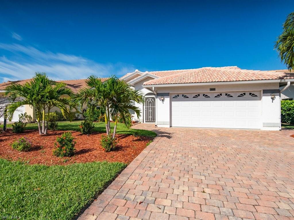 360 Fox Den Circle Naples, FL 34104 - Photo 4 of 41 a backyard of a house with plants and outdoor space