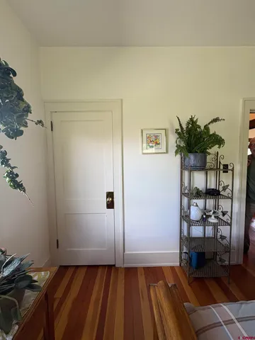 a bedroom with a bed and mirror