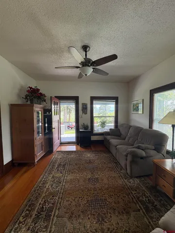 a view of living room with furniture and a window