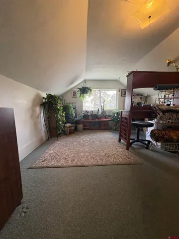 a bed room with a bed and a book shelf