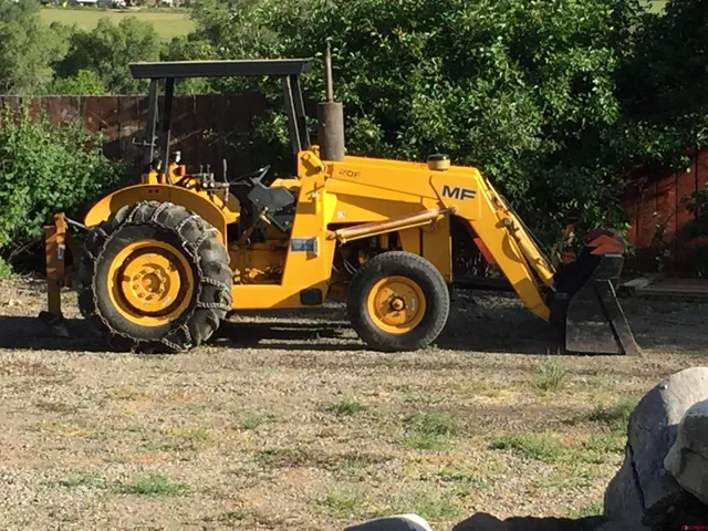 an aerial view of houses covered in trees