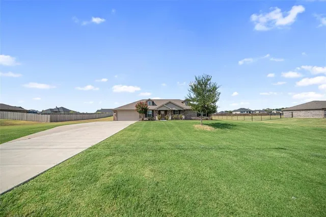 a view of green field with lake view