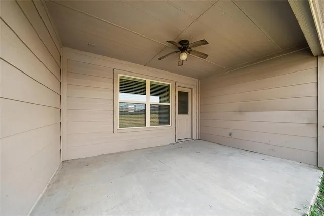 a view of empty room with windows