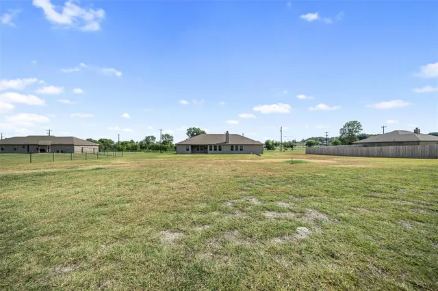 a view of a large body of water with a building in the background