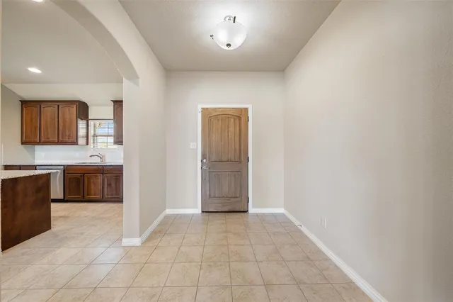 a view of a hallway to rooms