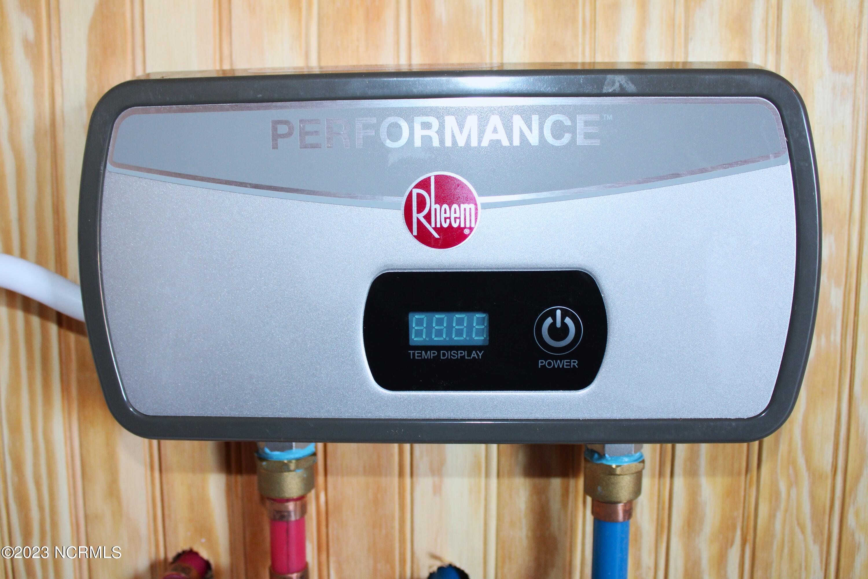 1490 Kellum Loop Road Jacksonville, NC 28546 - Photo 34 of 38 Tankless Water Heater - Laundry