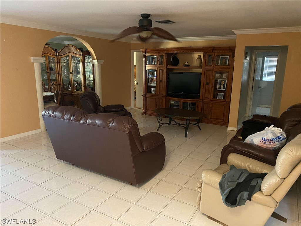 5968 Bay Point Road Bokeelia, FL 33922 - Photo 2 of 11 a living room with furniture and a flat screen tv