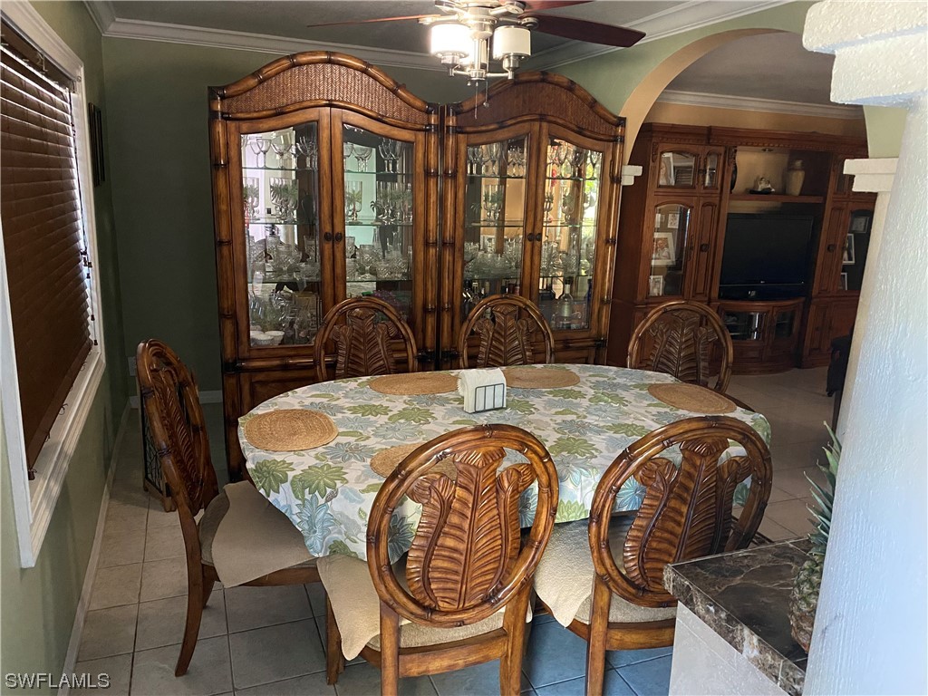 5968 Bay Point Road Bokeelia, FL 33922 - Photo 4 of 11 a dining room with furniture and window