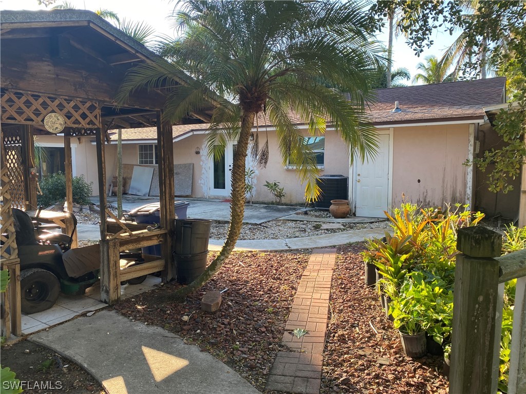 5968 Bay Point Road Bokeelia, FL 33922 - Photo 8 of 11 a view of a pathway with a patio