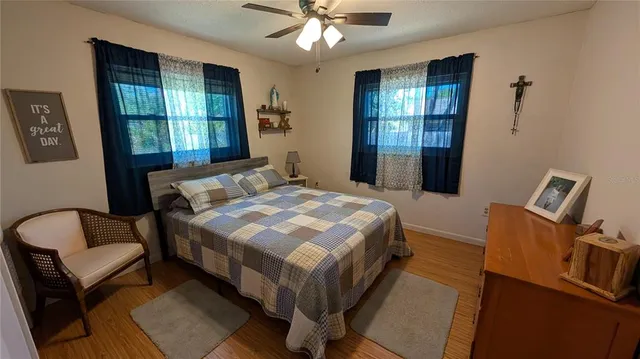 a bedroom with a bed and a couch