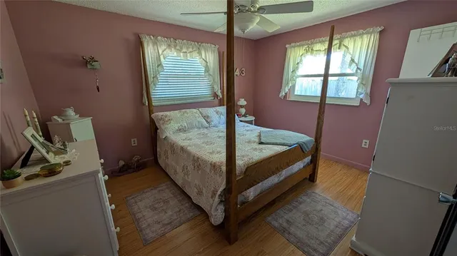 a bed room with a bed and a window