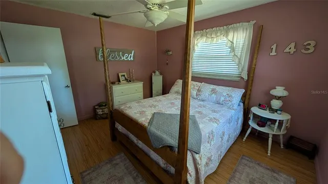 a bed room with a bed and a window