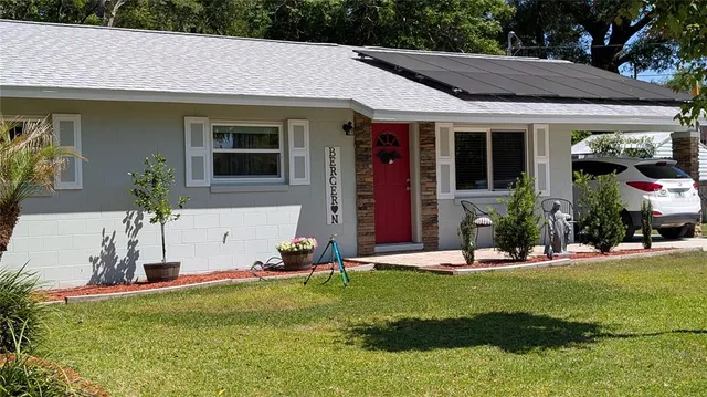 a front view of house with an outdoor seating