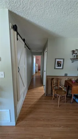 a view of a livingroom with furniture and wooden floor