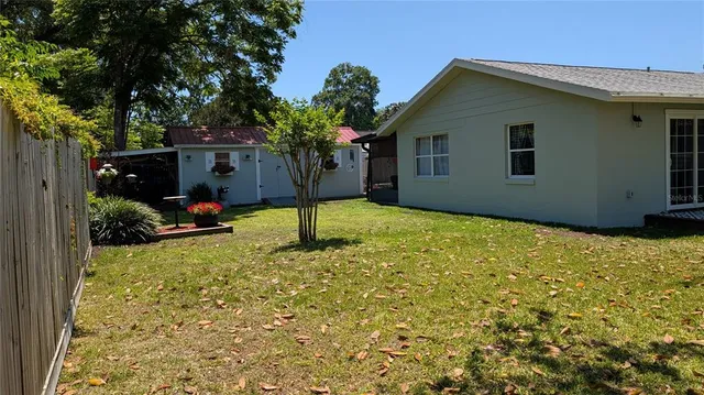 a backyard of a house with lots of green space