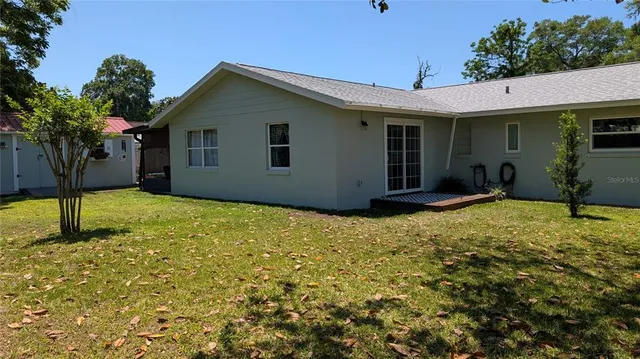 a house with trees in front of it