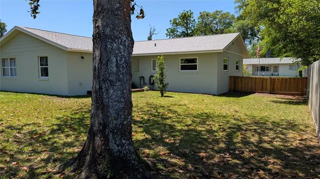 a swimming pool with wooden fence