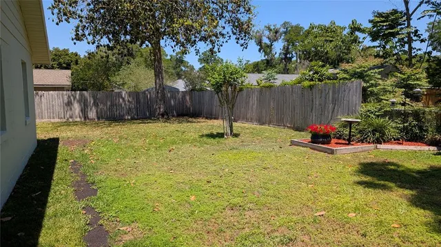 a bedroom with a bed and a mirror