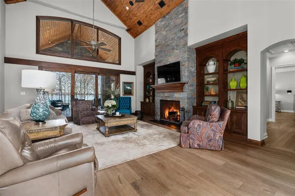 a living room with furniture and a fireplace