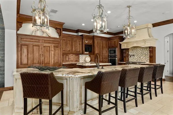 a kitchen with a table and chairs in it