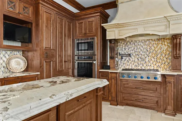 a kitchen with a refrigerator and a sink