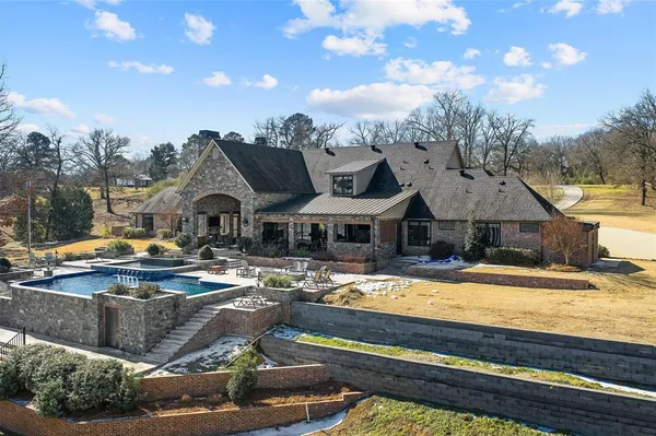 a view of multiple houses with a swimming pool