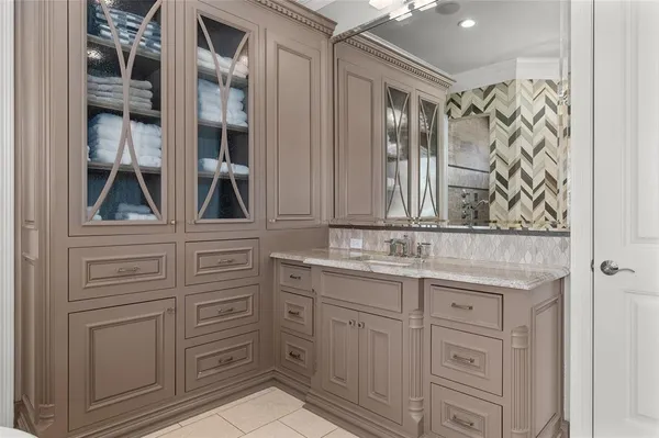 a bathroom with a sink a vanity and a mirror