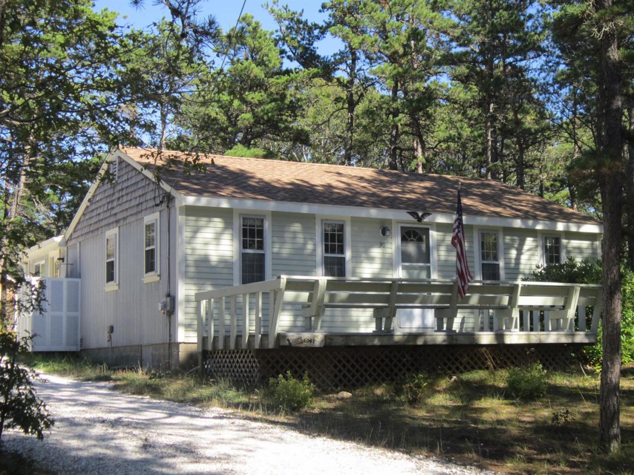 30 Bartlett Road Wellfleet, MA 02667 - Photo 1 of 12 a front view of a house with a yard