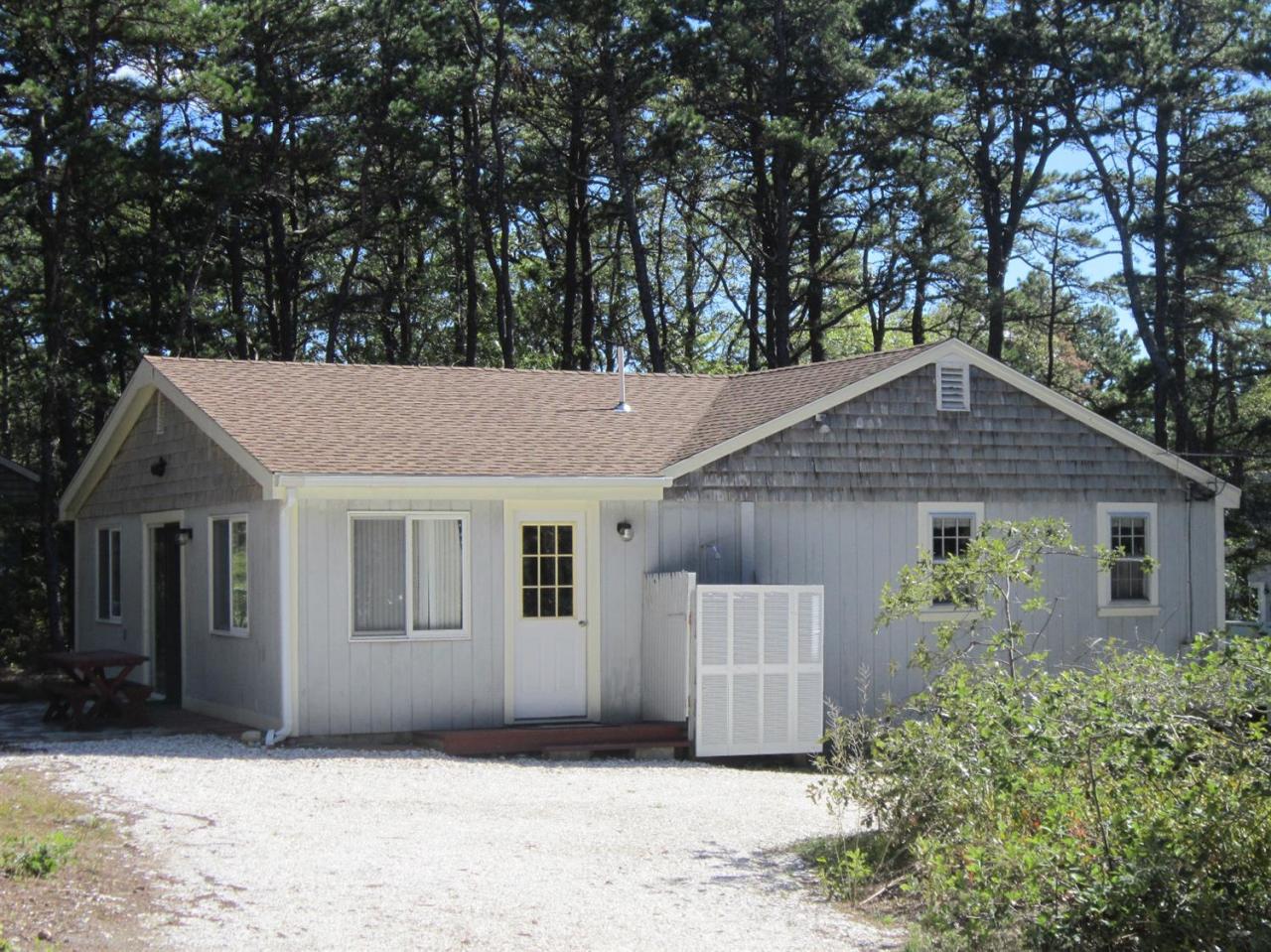 30 Bartlett Road Wellfleet, MA 02667 - Photo 2 of 12 a view of a house with a yard and large tree