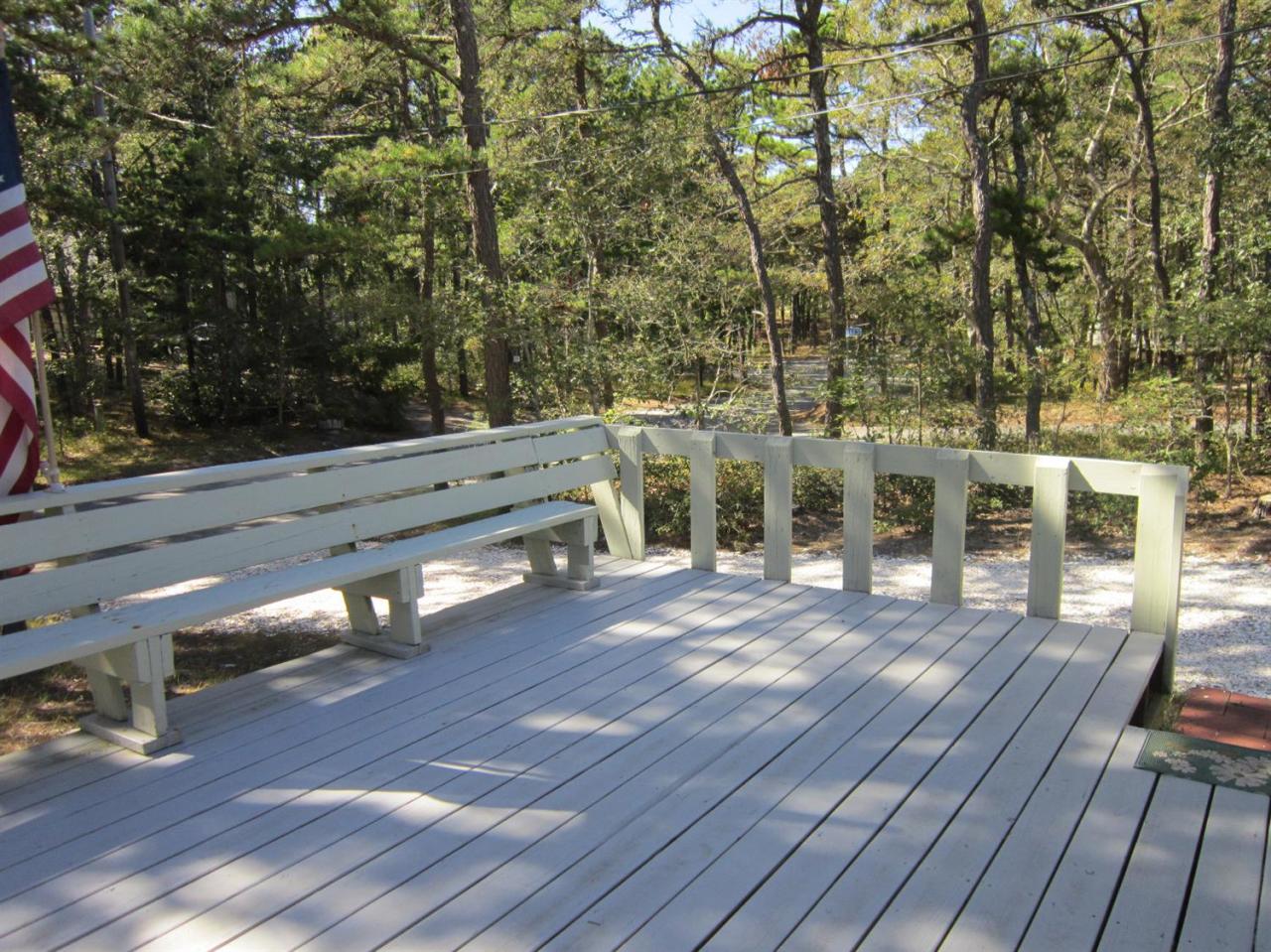 30 Bartlett Road Wellfleet, MA 02667 - Photo 5 of 12 a view of a chairs and table on the wooden floor