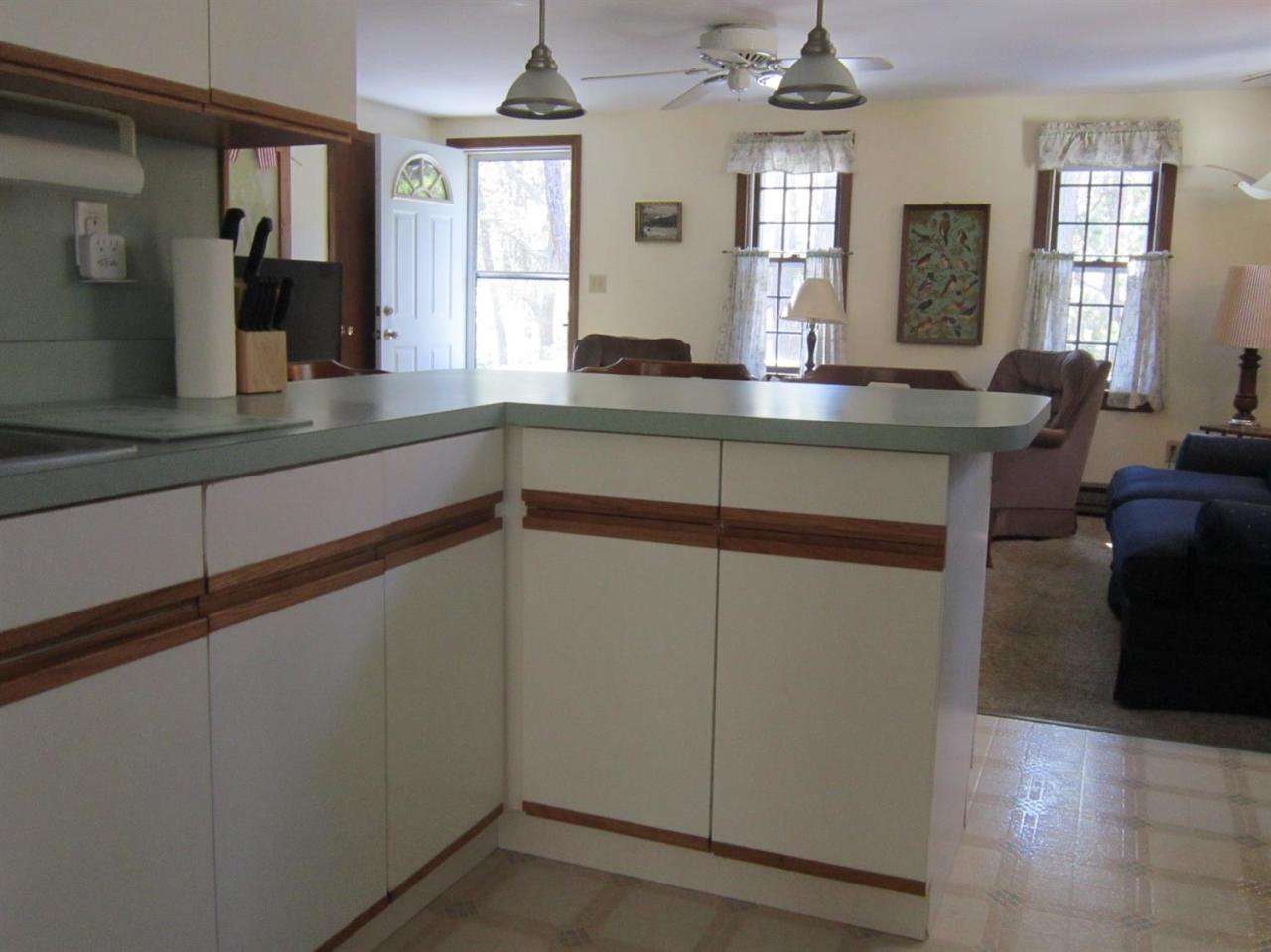30 Bartlett Road Wellfleet, MA 02667 - Photo 7 of 12 a kitchen with cabinets and window