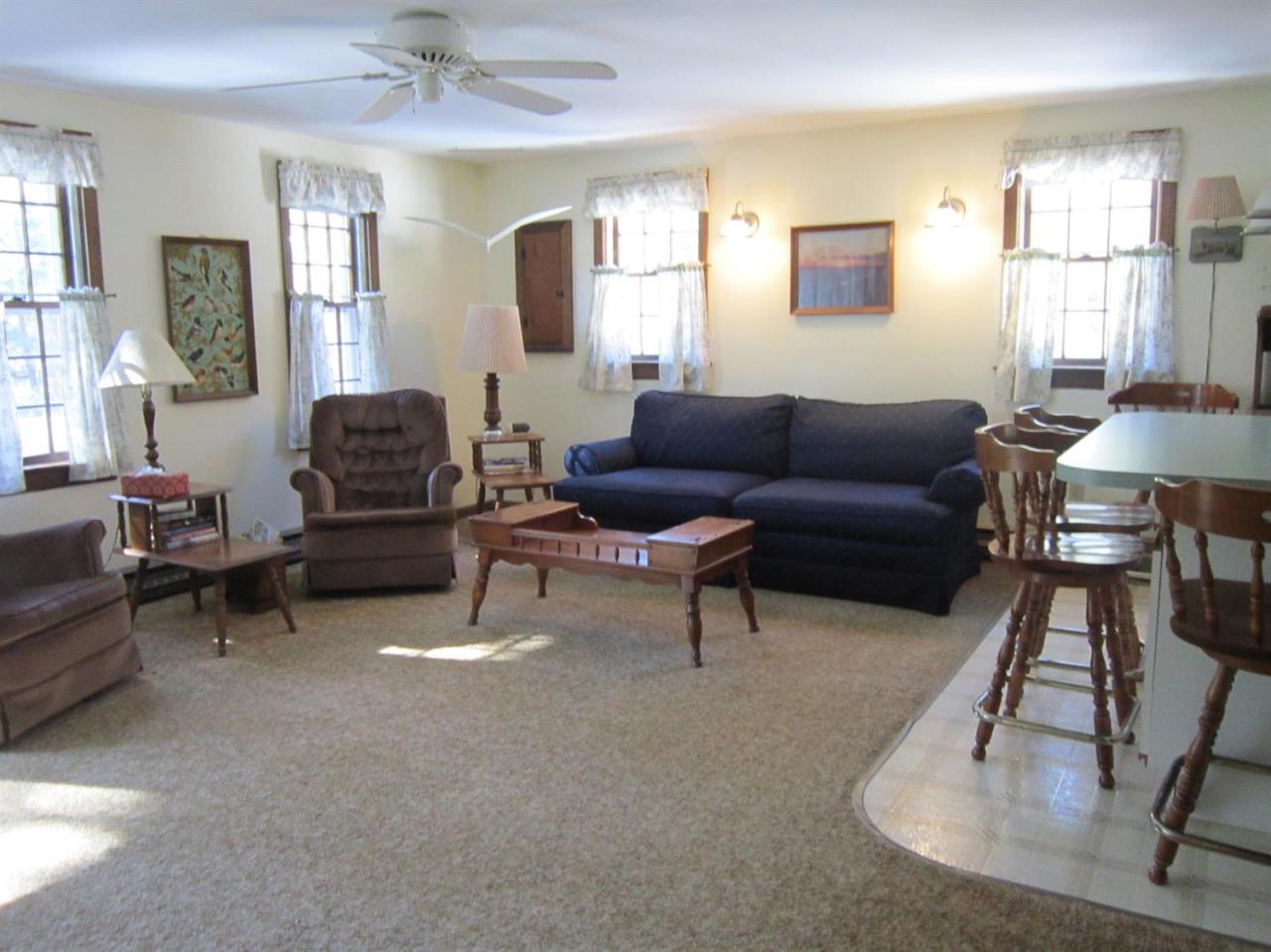 30 Bartlett Road Wellfleet, MA 02667 - Photo 8 of 12 a living room with furniture and a table