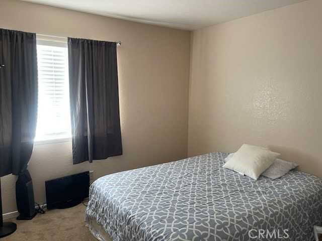 412 Yellowstone Circle Corona, CA 92879 - Photo 13 of 15 a bedroom with a bed and a window