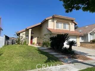 412 Yellowstone Circle Corona, CA 92879 - Photo 2 of 15 a front view of a house with a yard