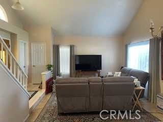 412 Yellowstone Circle Corona, CA 92879 - Photo 4 of 15 a living room with furniture and a flat screen tv