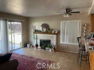 412 Yellowstone Circle Corona, CA 92879 - Photo 7 of 15 a living room with furniture and a fireplace