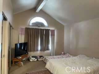 412 Yellowstone Circle Corona, CA 92879 - Photo 9 of 15 a bedroom with a bed and a mirror