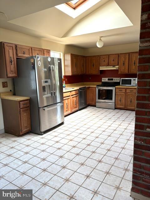 108 Kingbrook Road Linthicum Heights, MD 21090 - Photo 4 of 15 a kitchen with stainless steel appliances a refrigerator and a stove top oven