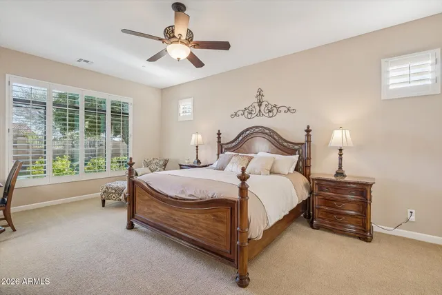 a bathroom with a sink a vanity a mirror and a bathtub