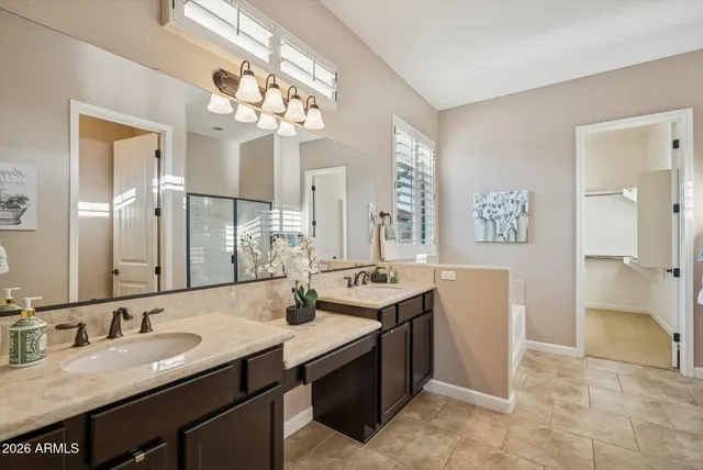 a bathroom with a bathtub and a window