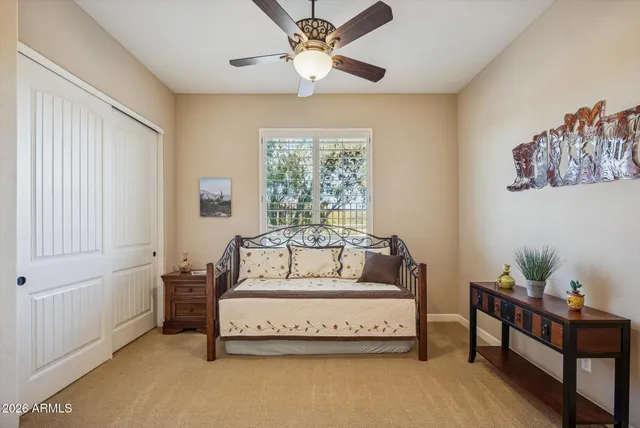 a bathroom with a sink a toilet and shower curtain