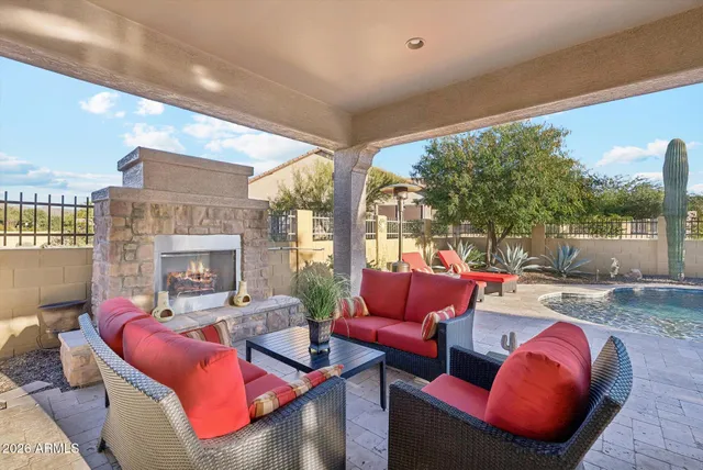 a outdoor living space with furniture and a ceiling fan